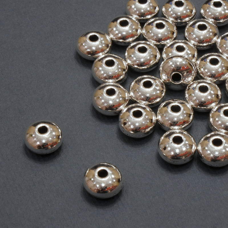 Furnitura jubilerska – koralik-wkładka wewnętrzna, średnica 1,7 mm +/-; średnica 7×4,5 mm +/-; opakowanie 20 g 25 szt. (+/-)