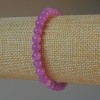 Bransoletka z tonowanego kwarcu pod ametyst, gładka kulka, na elastycznej nici, średnica około 6,5 mm, długość około 18 cm +/- (stretch)