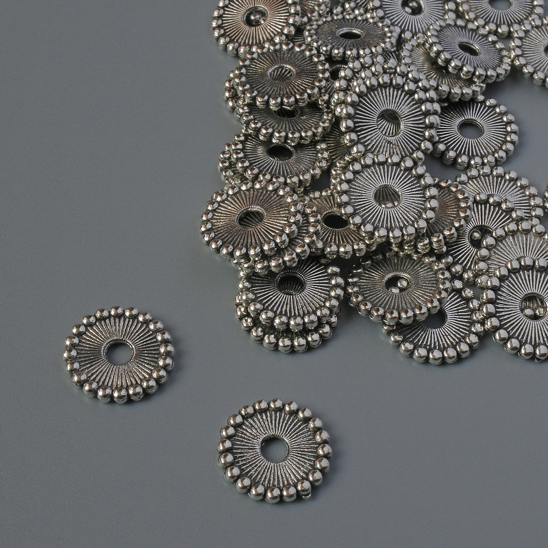 Furnitura jubilerska — wstawka do koralików, średnica 11×1,5 mm, otwór 2,4 mm, metal srebrzysty, opakowanie 43 szt., 20 g