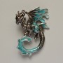 Broszka-wisiorek Smok z czarną i turkusową emalią z błyskotkami, srebrzysty metal, 42×58 mm