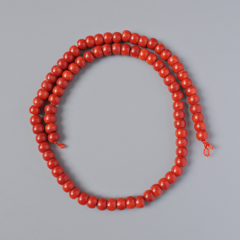 Koraliki z naturalnego korala, gładkie w formie rondeli, średnica 7×5 mm, długość 41 cm, na nitce
