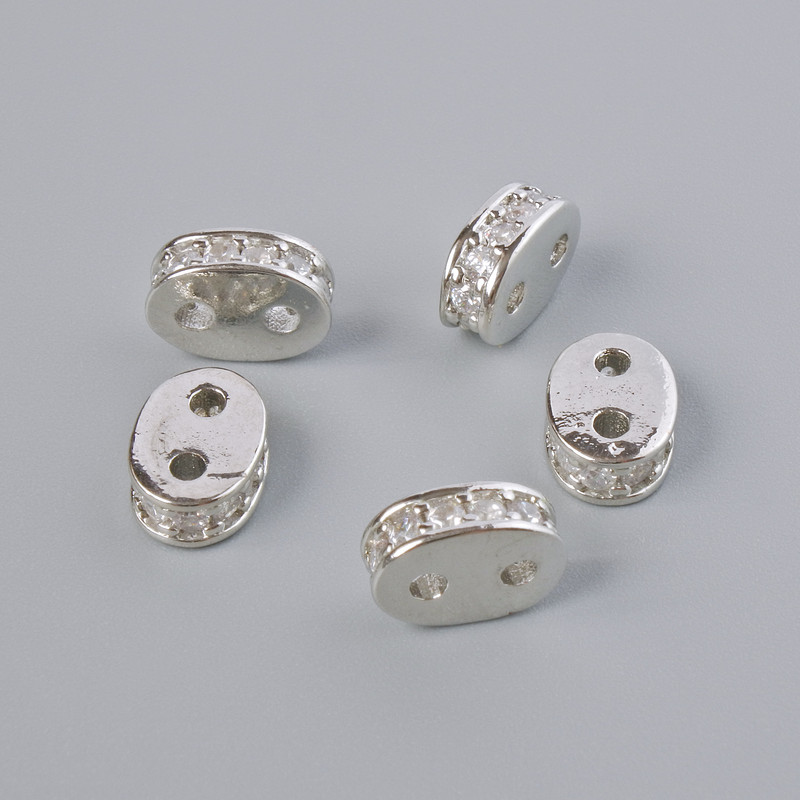 Rozdzielnik na dwie nici z białymi kryształami, srebrzysty kolor metalu, średnica 8×3 mm, ±1 szt.