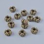 Bronzowe koraliki-wstawki, średnica 7,5×4 mm, otwór 2,6 mm, fasetowane, 13 szt. ±, kolor metalu brązowy
