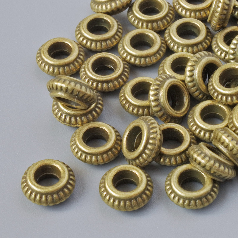 Koralik-wstawka, średnica 7×3 mm, średnica otworu 2,8 mm, opakowanie 35 szt. ±, kolor metalu: brązowy
