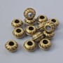 Koralik-wkładka do biżuterii, średnica 9×5,5 mm, średnica otworu 3,6 mm, opakowanie 14 szt. ±, kolor metalu: brązowy