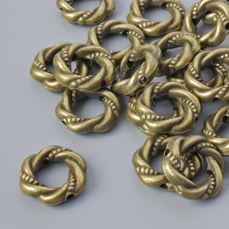 Koralik-wstawka do biżuterii, średnica 11×3 mm, otwór 1,1 mm, opakowanie 16 szt. +/-; kolor metalu: brązowy