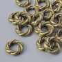 Koralik-wstawka do biżuterii, średnica 11×3 mm, otwór 1,1 mm, opakowanie 16 szt. +/-; kolor metalu: brązowy