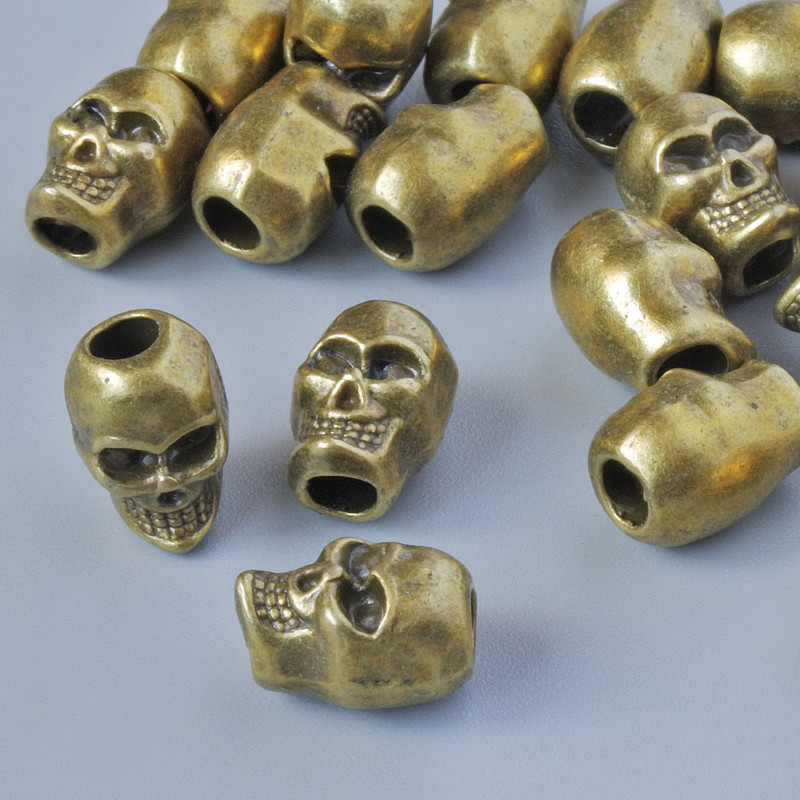 Koralik-wstawka «Czaszka», wymiary 9×6 mm, otwór 2,6 mm, opakowanie 18 szt. ±, kolor metalu: brązowy