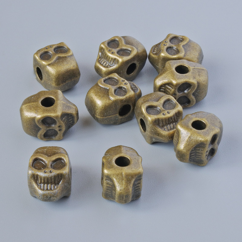 Koralik-wkładka «Czaszka», wymiary 11×8×7 mm, średnica otworu 2,6 mm, opakowanie 10 szt ±, kolor metalu brązowy