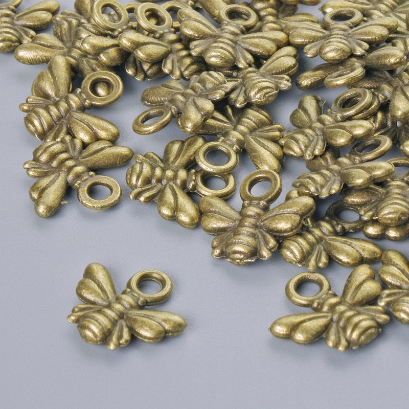 Zawieszka 'Pszczółka', średnica 10×11 mm, średnica otworu 1,9 mm, op. 33 szt. ±, kolor brązowy metalu