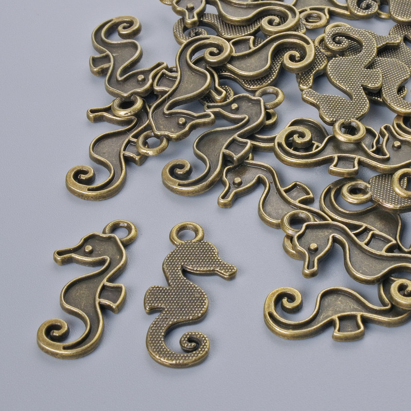 Zawieszka do biżuterii „Konik morski”, średnica 22×10 mm, średnica otworu 2,1 mm, opakowanie: 26 szt. +/- kolor metalu: brązowy