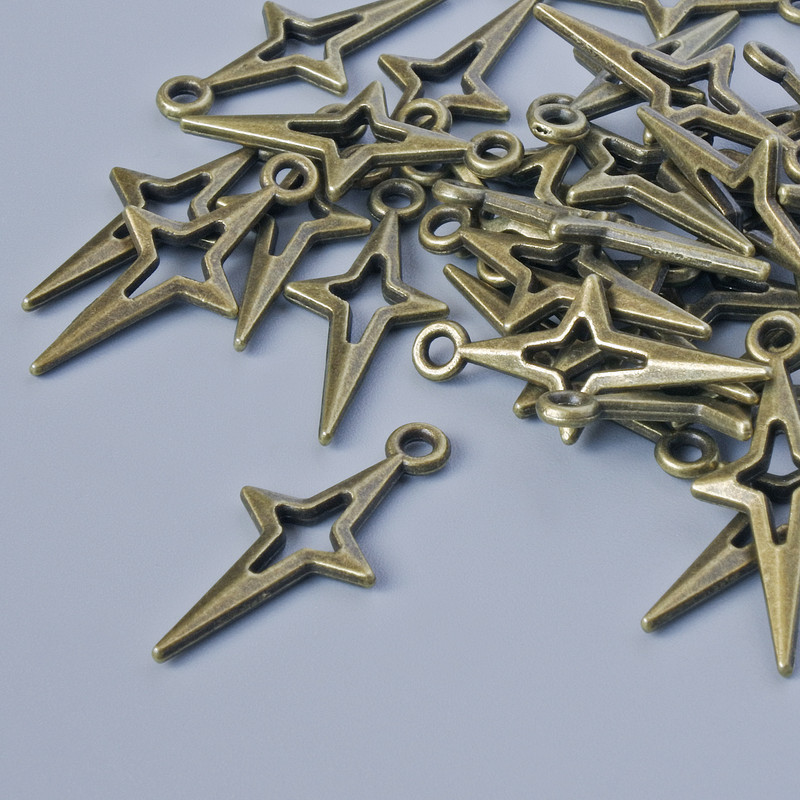 Zawieszka ozdobna „Gwiazda”, średnica 23×10 mm, średnica otworu 1,6 mm, opakowanie 30 szt. ±, kolor metalu brązowy