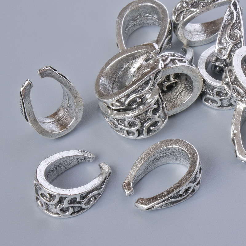 Furnitura jubilerska – zawieszka do wisiorków, wymiary 15×11×6 mm, otwór 10,7×7,2 mm, opakowanie 13 szt. ± 20 g, kolor metalu: srebrzysty