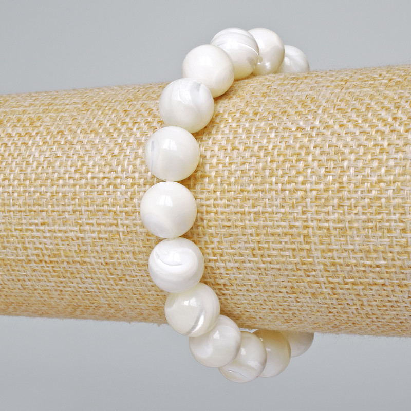 Bransoletka z naturalnej masy perłowej, gładkie kulki o średnicy 10 mm, długość 18 cm, elastyczna