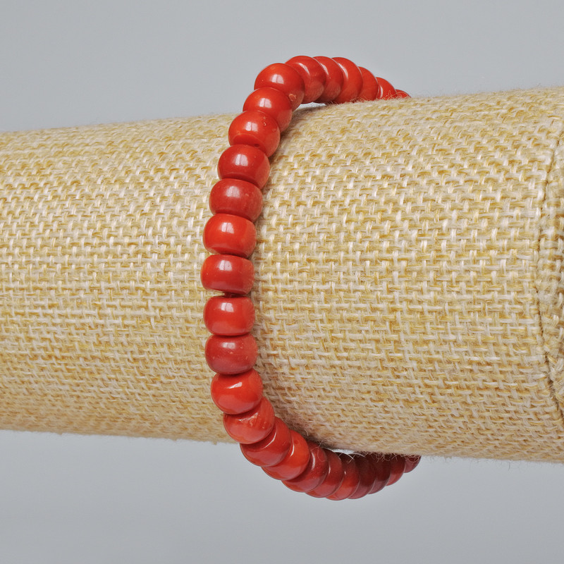 Bransoletka z naturalnego koralu, gładkie rondelki o średnicy około 7×5 mm, długość około 18 cm (na elastycznej bazie)