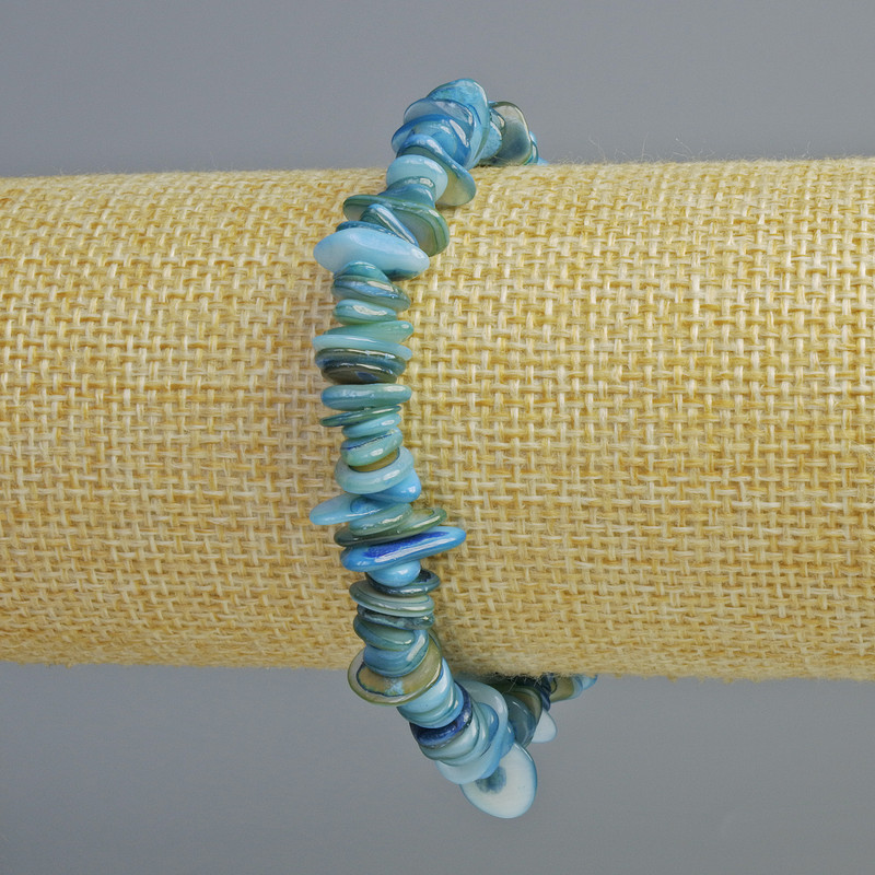 Bransoletka z tonowanej niebieskiej masy perłowej – kawałki, średnica 10×2 mm, długość 18 cm (elastyczna)