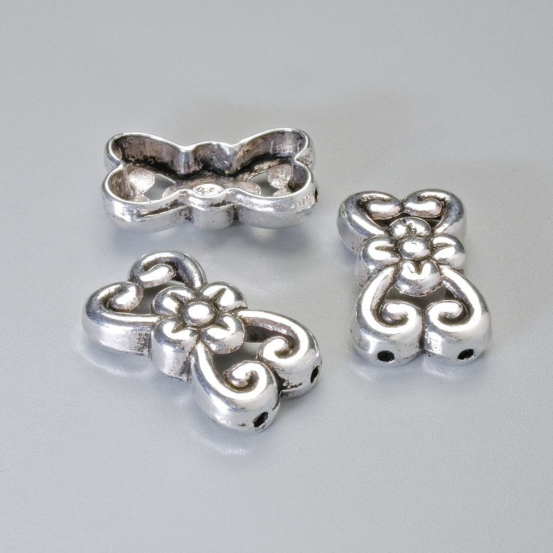 Koralik-wkładka do biżuterii na dwie nitki, wymiary 18,5×11 mm, otwór o średnicy 1,3 mm, kolor metalu: srebrzysty, 4 szt.