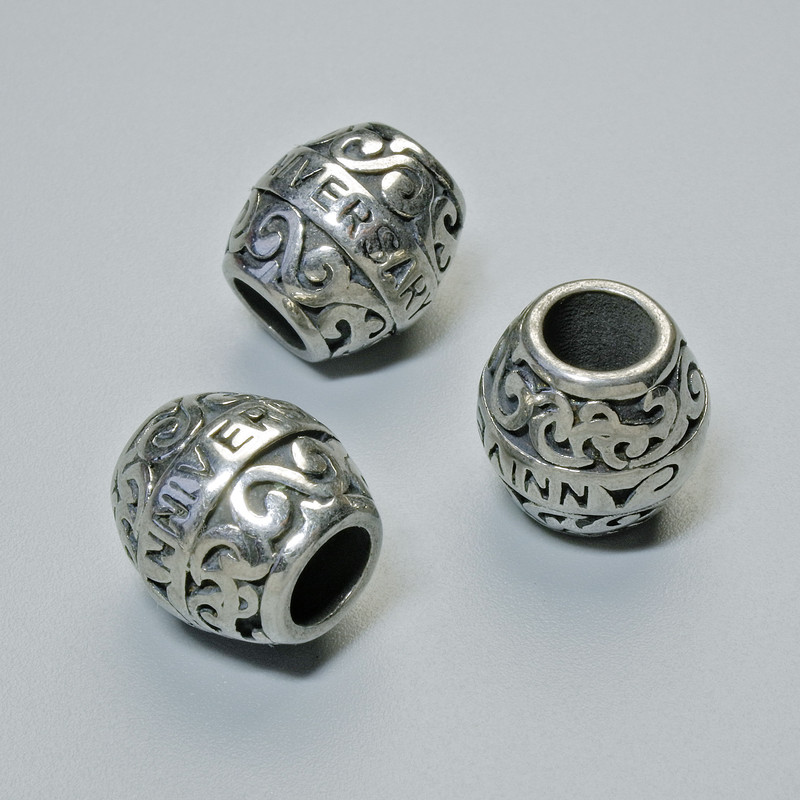 Element ozdobny - koralik-wstawka, średnica 11x11 mm, otwór 4,8 mm, srebrzysty kolor metalu, 1 szt.