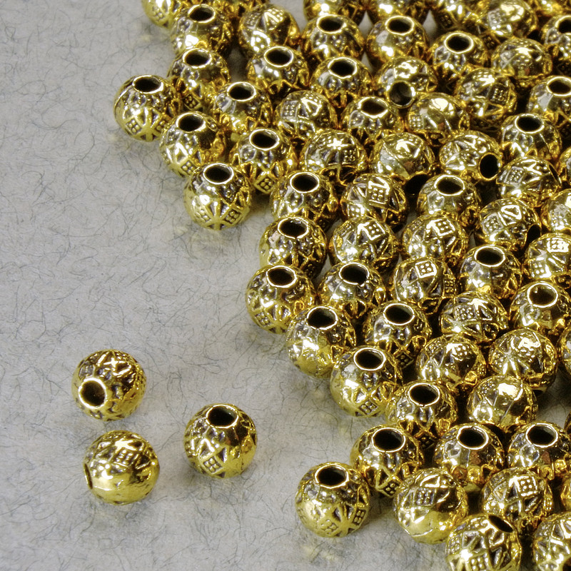 Akcesoria jubilerskie: koraliki-wkładki, średnica 4 mm, otwór 1,4 mm, kolor metalu złoty, opakowanie 20 g +- 110 szt. +