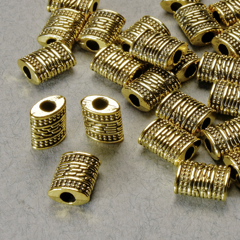 Koralik-wstawka, wymiary 9×7×4 mm, średnica otworu 2,5 mm, kolor metalu złoty, opakowanie 20 g ± 25 szt.