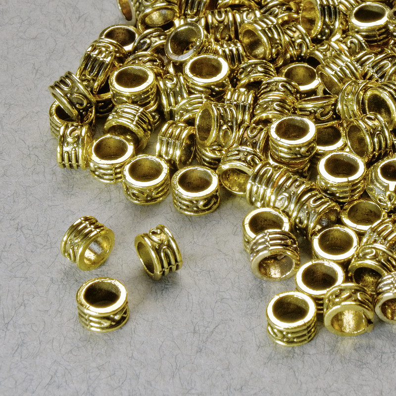 Koralik-wkładka, średnica 3x5 mm, otwór 3,3 mm, złoty kolor metalu, opakowanie 20 g +- 140 szt. +