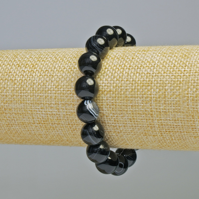 Bransoletka z czarnego agatu, gładkie kulki o średnicy 12 mm ± (elastyczna), długość 18 cm+
