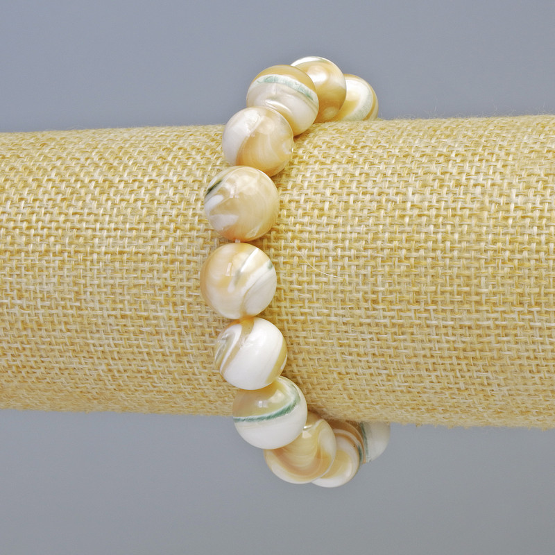 Bransoletka z naturalnej masy perłowej, gładka kuleczka, średnica 12 mm ± (rozciągana), długość 18 cm+