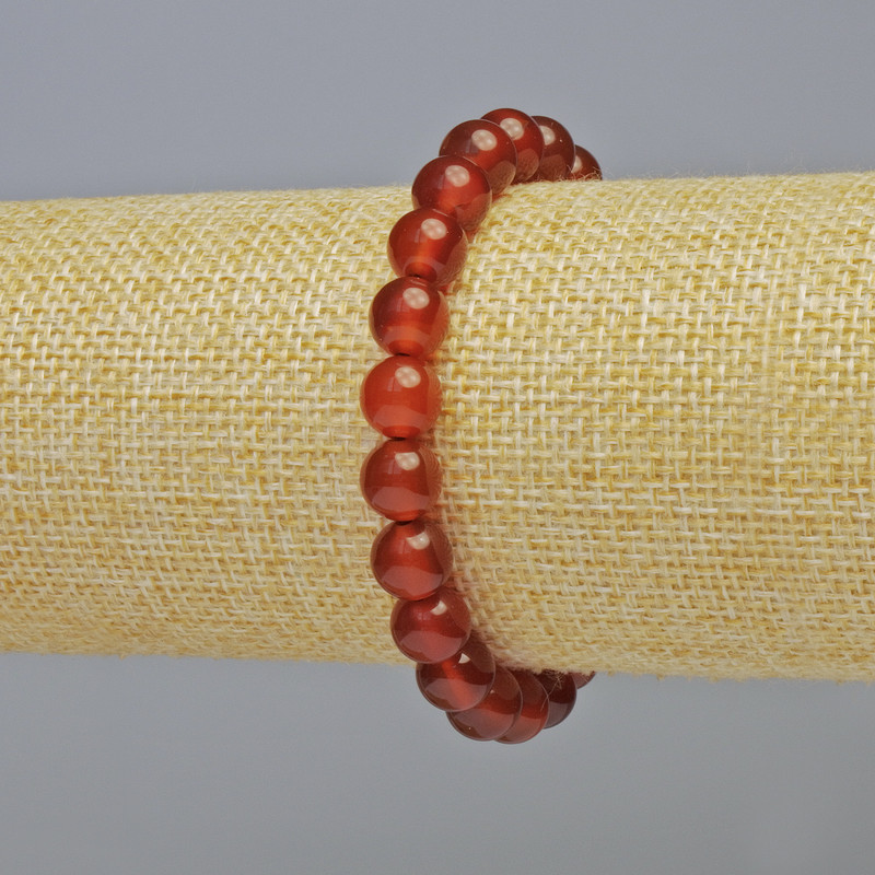 Bransoletka z karneolu, naturalny kamień, gładka kulka o średnicy około 8 mm, na elastycznej gumce, długość 18 cm+