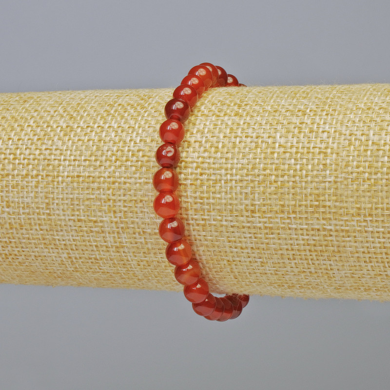 Bransoletka z karneolu, naturalny kamień, gładkie kuleczki, średnica około 6 mm, na elastycznej gumce, długość około 18 cm