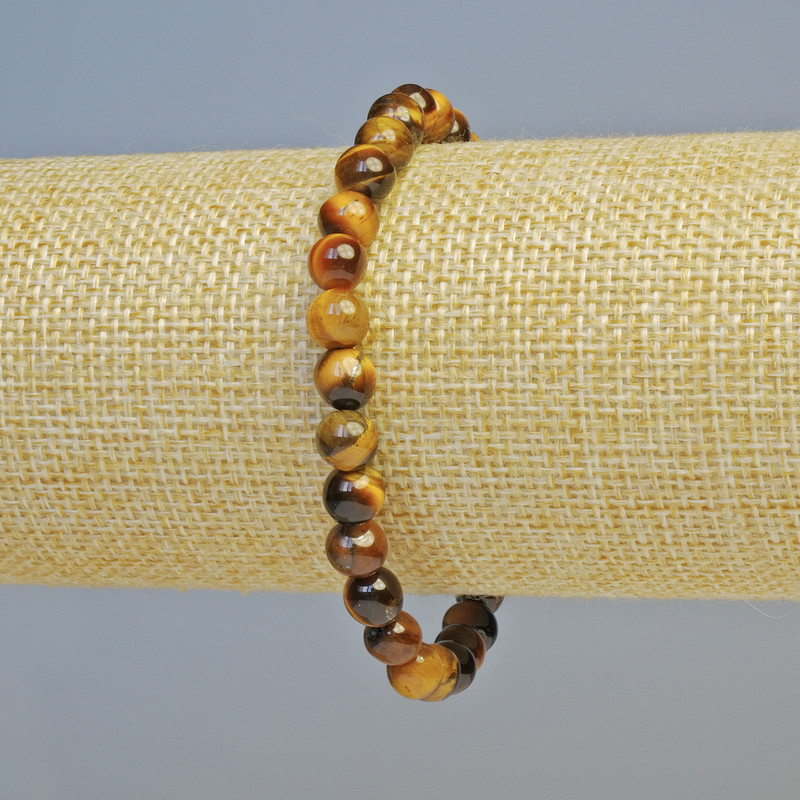 Bransoletka z naturalnego kamienia – tygrysie oko, gładka kulka, średnica około 6,5 mm, ± (rozciągliwa), długość 18 cm