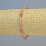 Bransoletka z kwarcu truskawkowego — naturalny kamień, fasetowane sześciany o średnicy ok. 5 mm, na elastycznej gumce, długość 18 cm
