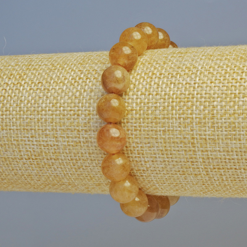 Bransoletka z kalcytu, gładkie kuleczki o średnicy 10 mm ± (rozciągliwa), długość 18 cm+