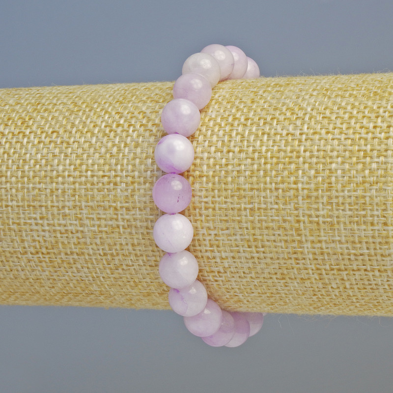 Bransoletka z sztucznego kunzytu (kuleczki gładkie) o średnicy 8 mm ± (elastyczna), długość 18 cm+