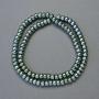 Koraliki hematitu w kolorze zielony chameleonowy, średnica 6×4 mm, długość ok. 42 cm