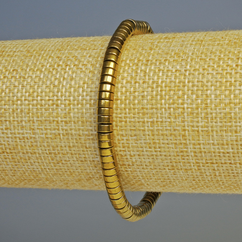 Bransoletka z hematitu w kolorze ciemnego złota, o rondelowym kształcie, średnica 5×2 mm, długość 18 cm, elastyczna