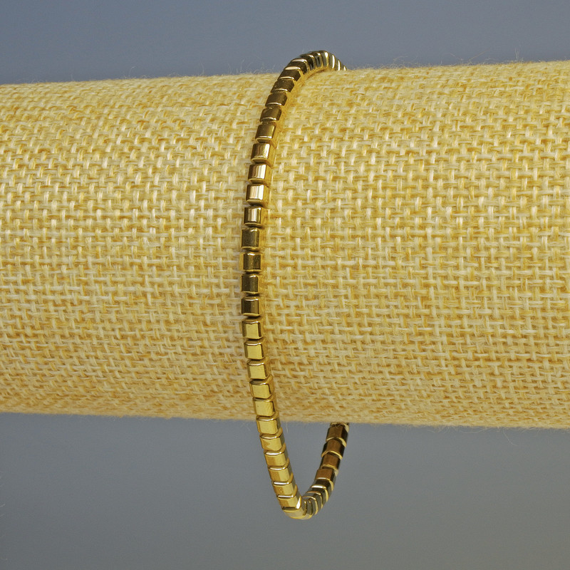 Bransoletka hematytu – drobne kosteczki, kolor złoty, średnica 3×3 mm, długość 18 cm, elastyczna