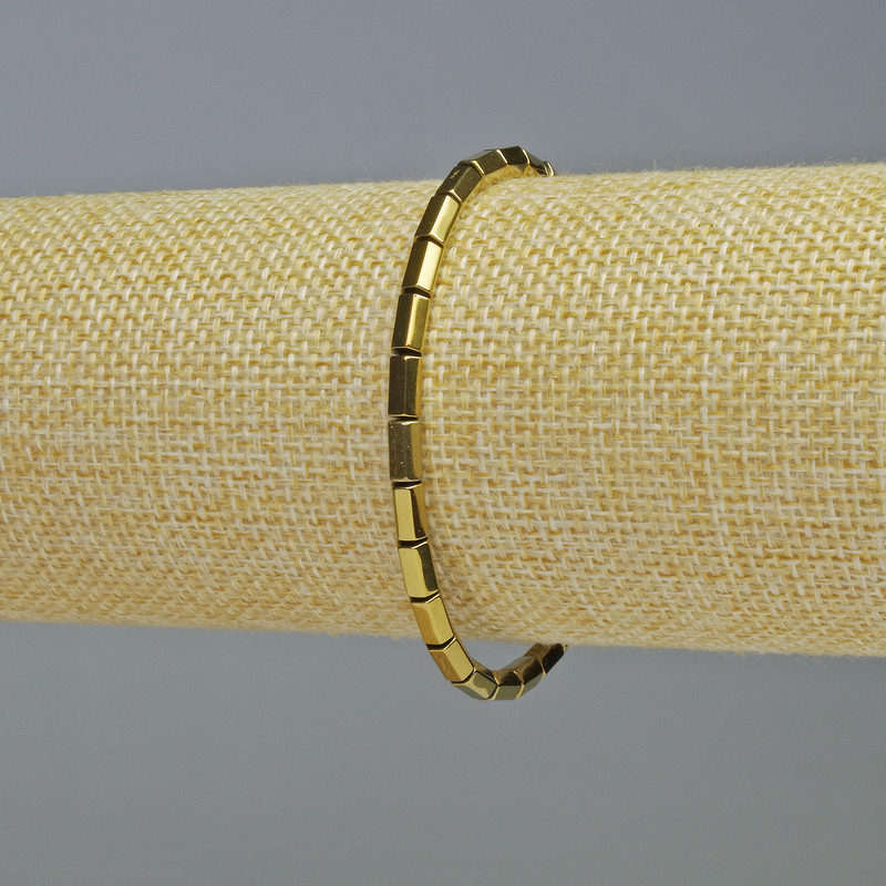 Bransoletka z hematytu w kształcie zaokrąglonych sześciokątów, kolor złoty, średnica 5×4 mm, długość 18 cm, elastyczna