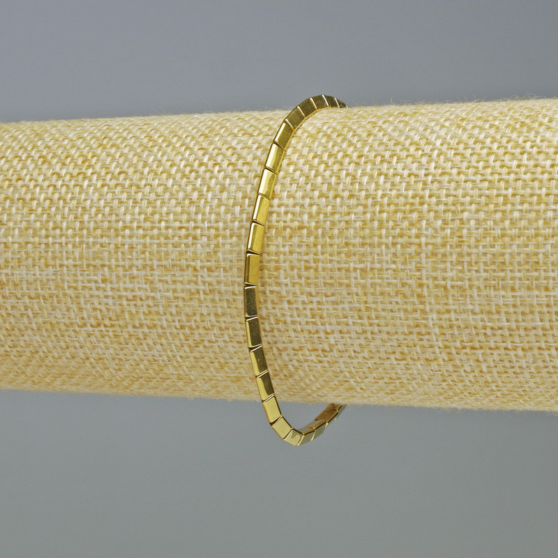 Bransoletka z hematytu w kształcie trójkątów, kolor złoty, średnica 5×2 mm, długość 18 cm, elastyczna