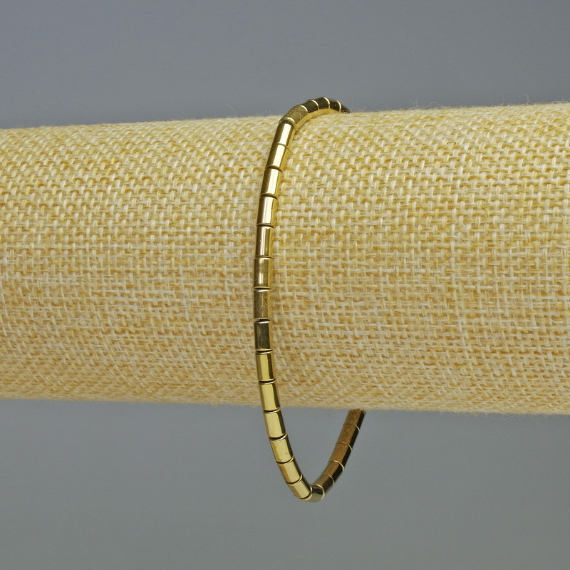Bransoletka hematyt cylindryczny w kolorze złotym, średnica 5×3 mm, długość 18 cm, elastyczna