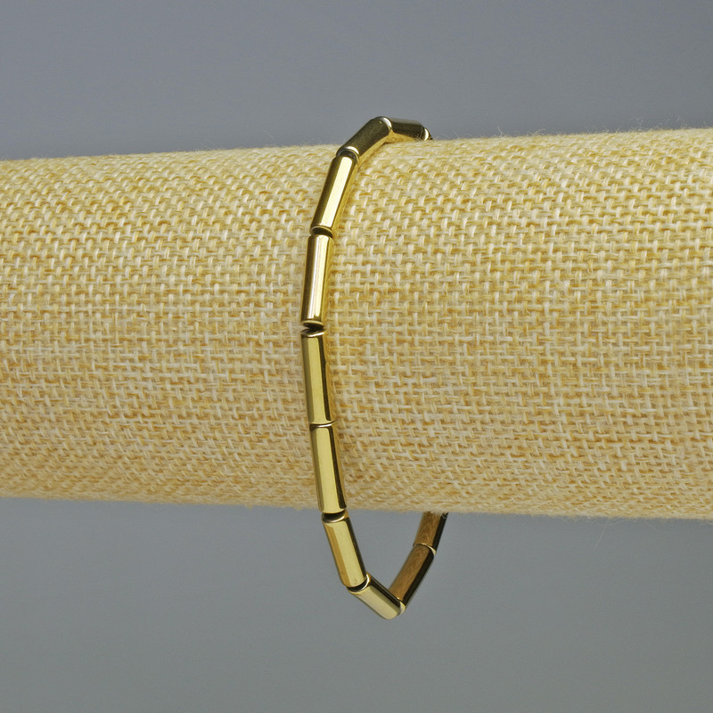 Bransoletka z hematitu cylindryczna, kolor złoty, średnica 12×4 mm, długość 18 cm, elastyczna