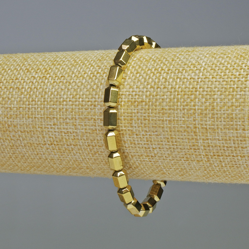 Bransoleta z hematytu w kolorze złotym w kształcie sześciokątów, średnica 5×8 mm, długość 18 cm, elastyczna