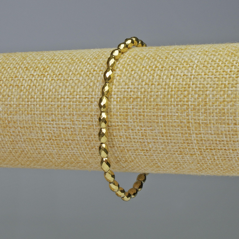 Bransoletka z hematytu fasetowanego owalnego kształtu w kolorze złotym, średnica 4×6 mm, długość 18 cm, elastyczna