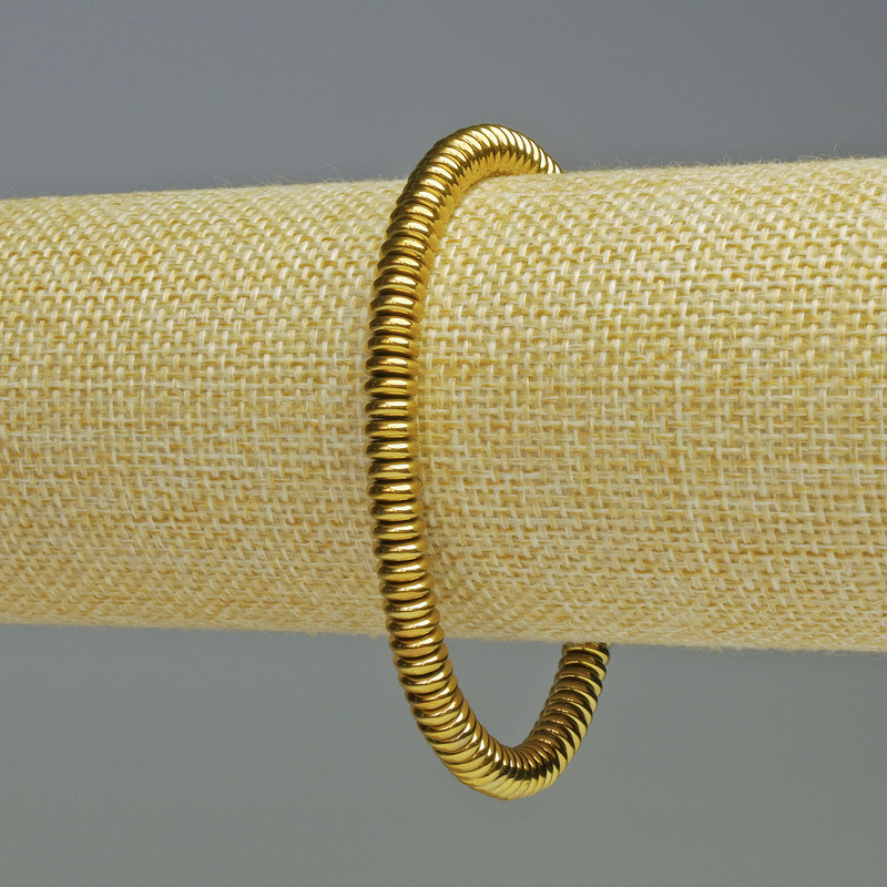 Bransoletka z hematitu w kolorze ciemnego złota, o średnicy 6×2 mm, długości 18 cm, elastyczna