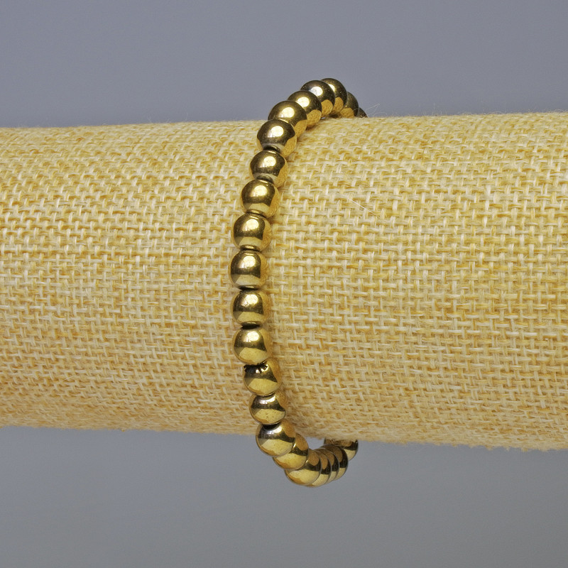 Bransoletka hematyt w złocistym odcieniu, gładkie kuleczki, średnica 6 mm, długość 18 cm, elastyczna nić