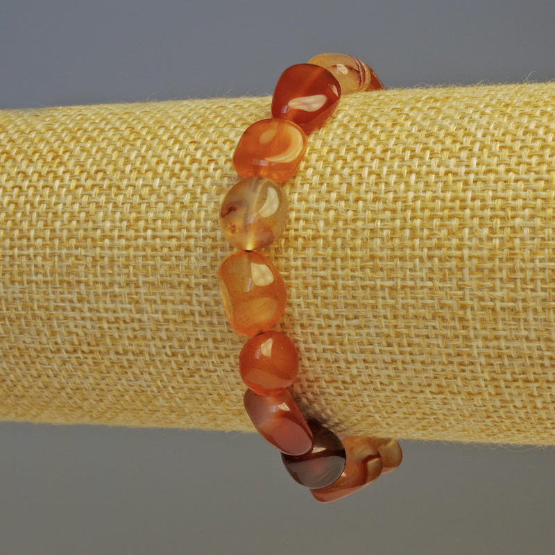 Bransoletka z karneolem fasetowanym, średnica 10×8 mm, długość 18 cm, na elastycznej gumce