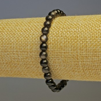 Bransoleta ze srebrzystego obsydianu, gładkie kulki o średnicy około 6 mm, długość 18 cm, elastyczna