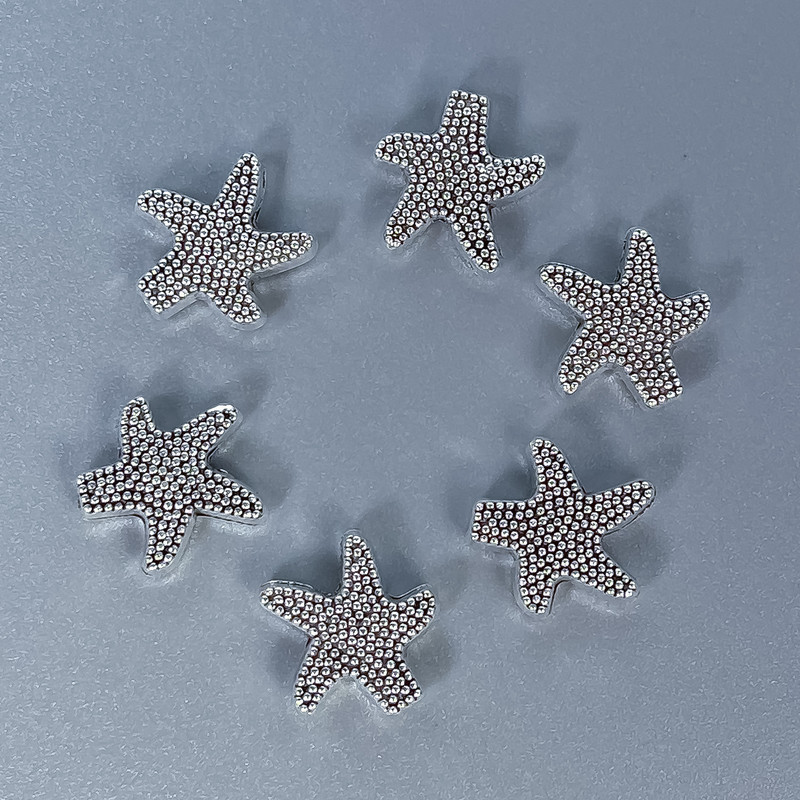 Koralik-wstawka Gwiazdka, kolor metalu: srebrny, średnica 10×3 mm ± otwór 1 mm ± opakowanie 11 szt.