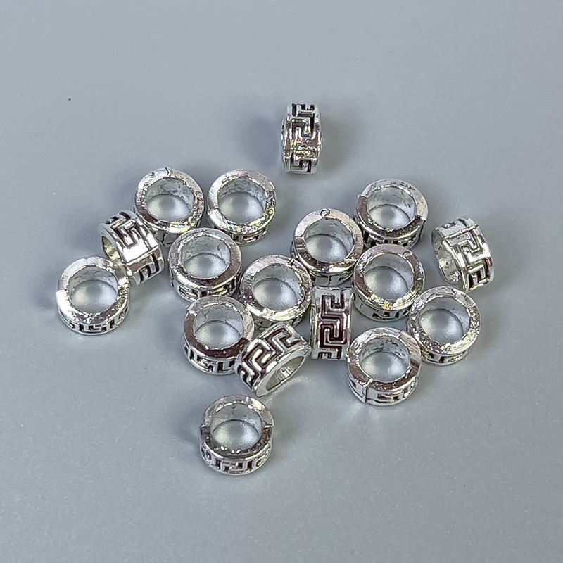 Srebrzysta koralika-wstawka, kolor metalu: srebro, średnica 6×3 mm ± otwór, średnica 4 mm ±, opakowanie 20 g (~80 szt.)