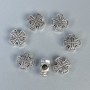 Koralik-wstawka w kształcie krzyża, kolor metalu srebrny, średnica 9×9×4 mm, otwór o średnicy ~2,5 mm, opakowanie 20 g (~20 szt.)