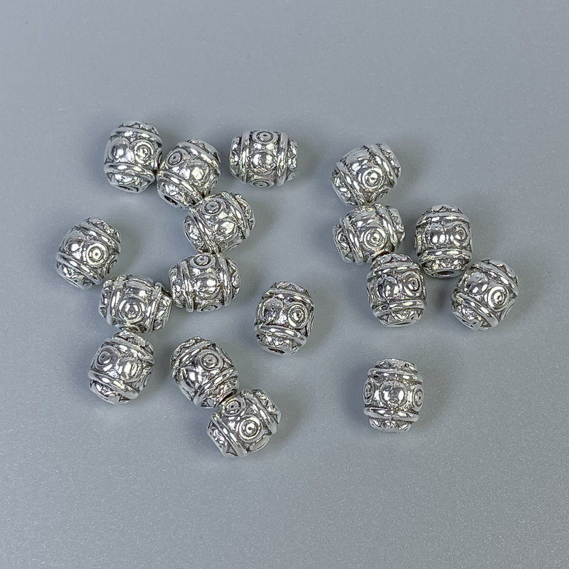 Koralik-wkładka, kolor srebrny, średnica 6×7 mm, otwór Ø 1 mm, opakowanie 20 g (~26 szt.)